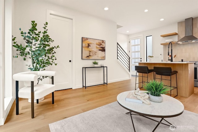 1120 NW 61st St Unit B, Seattle, WA 98107 - living room featuring light wood-style floors, recessed lighting, and stairway