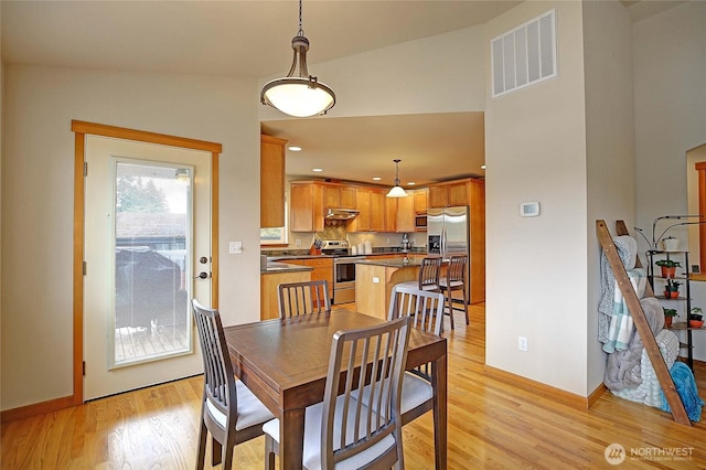2102 256th St NW, Stanwood, WA 98292 - dining room with light wood-style flooring and recessed lighting