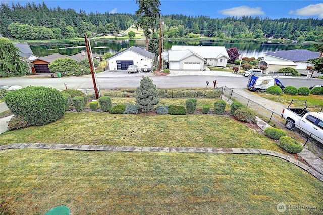 2102 256th St NW, Stanwood, WA 98292 - view of yard featuring a forest view, a water view, a garage, and driveway