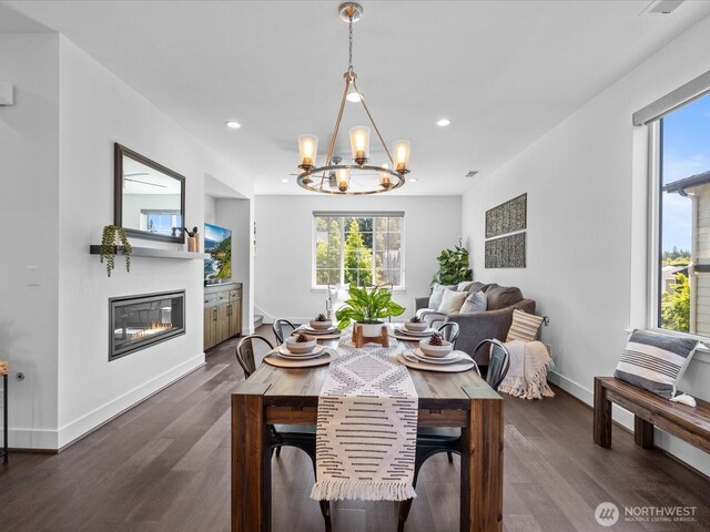 14031 3rd Ave NE, Duvall, WA 98019 - dining area with healthy amount of natural light, a glass covered fireplace, a chandelier, dark wood-style flooring, and recessed lighting