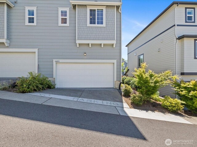 14031 3rd Ave NE, Duvall, WA 98019 - view of front facade with a garage and concrete driveway