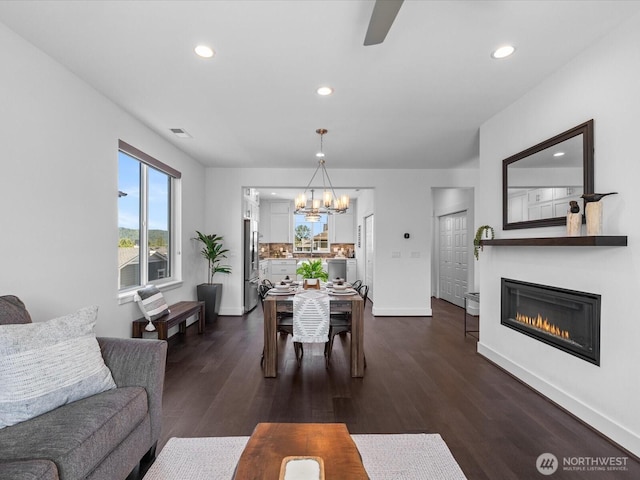 14031 3rd Ave NE, Duvall, WA 98019 - living area with a chandelier, recessed lighting, dark wood-type flooring, a glass covered fireplace, and a ceiling fan