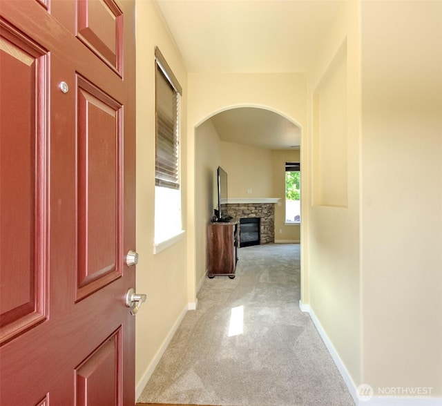 1605 Riddell Ave NE, Orting, WA 98360 - corridor featuring light colored carpet and arched walkways