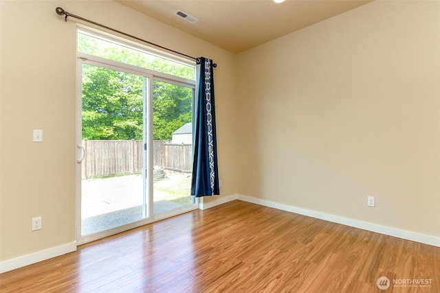 1605 Riddell Ave NE, Orting, WA 98360 - unfurnished room featuring wood finished floors and baseboards