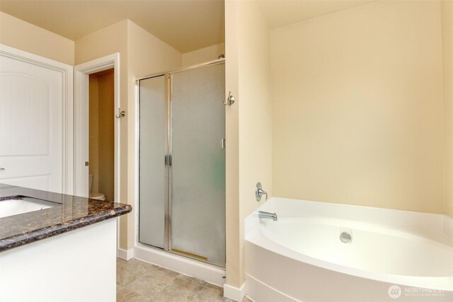 1605 Riddell Ave NE, Orting, WA 98360 - bathroom with a shower stall, a garden tub, and vanity