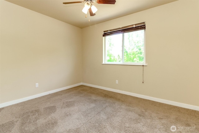 1605 Riddell Ave NE, Orting, WA 98360 - carpeted spare room with baseboards and a ceiling fan