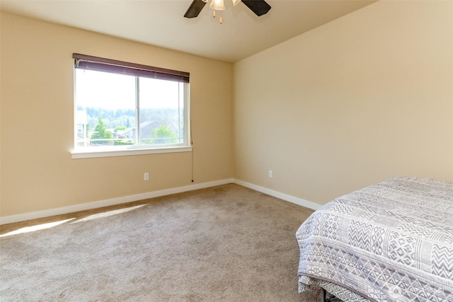 1605 Riddell Ave NE, Orting, WA 98360 - unfurnished bedroom featuring carpet and a ceiling fan