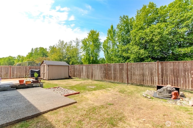 1605 Riddell Ave NE, Orting, WA 98360 - fenced backyard with a patio area and a storage shed