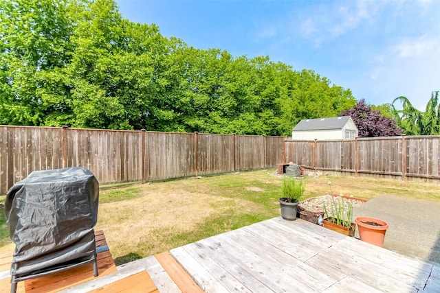 1605 Riddell Ave NE, Orting, WA 98360 - fenced backyard with a deck