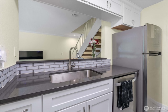 2822 Garden Ct Unit B, Steilacoom, WA 98388 - kitchen with appliances with stainless steel finishes, decorative backsplash, white cabinets, and open floor plan