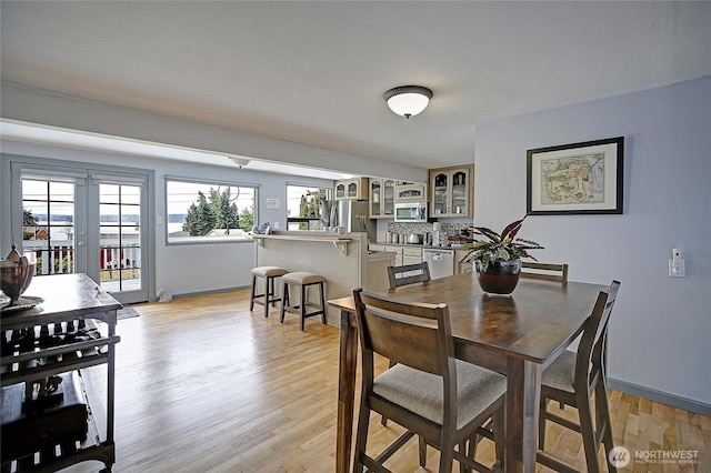 858 Westview Ct, Camano Island, WA 98282 - dining room with light wood finished floors and baseboards