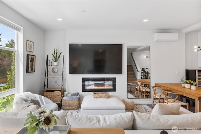 21511 50th Ave W Unit E, Mountlake Terrace, WA 98043 - living area with a wall mounted AC, stairway, a glass covered fireplace, and recessed lighting