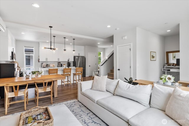 21511 50th Ave W Unit E, Mountlake Terrace, WA 98043 - living room with recessed lighting, stairway, light wood-type flooring, and a chandelier