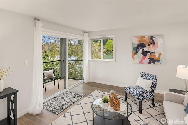19428 N Aurora Ave Unit 236, Shoreline, WA 98133 - living room with wood finished floors and healthy amount of natural light
