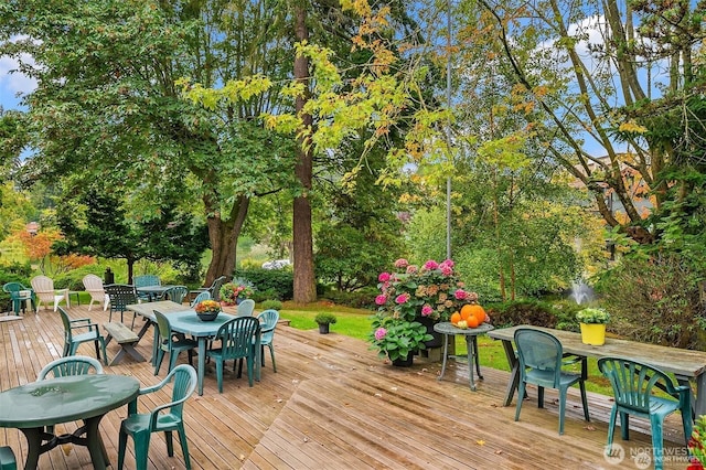19428 N Aurora Ave Unit 236, Shoreline, WA 98133 - wooden terrace with outdoor dining space and view of scattered trees