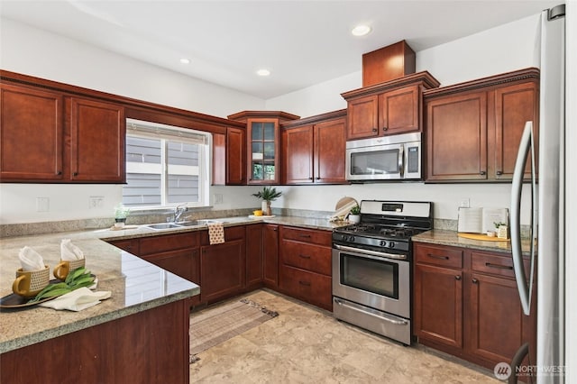 4246 Stonecrest Ct, Bellingham, WA 98226 - kitchen with stainless steel appliances, light stone countertops, glass insert cabinets, and recessed lighting