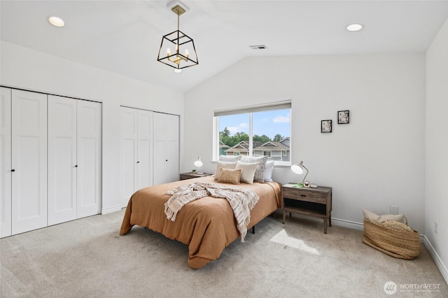 4246 Stonecrest Ct, Bellingham, WA 98226 - bedroom featuring two closets, light carpet, lofted ceiling, and recessed lighting