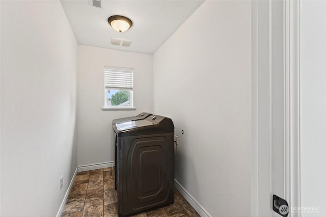 4246 Stonecrest Ct, Bellingham, WA 98226 - laundry room featuring dark stone finish floors and washing machine and dryer
