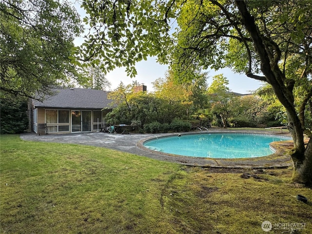 8855 Points Dr NE, Clyde Hill, WA 98004 - outdoor pool with a sunroom and a lawn
