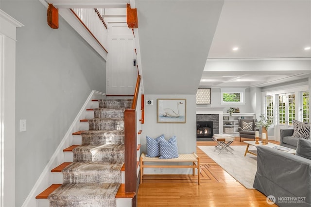 2836 32nd Ave S, Seattle, WA 98144 - staircase featuring wood finished floors, a stone fireplace, and recessed lighting