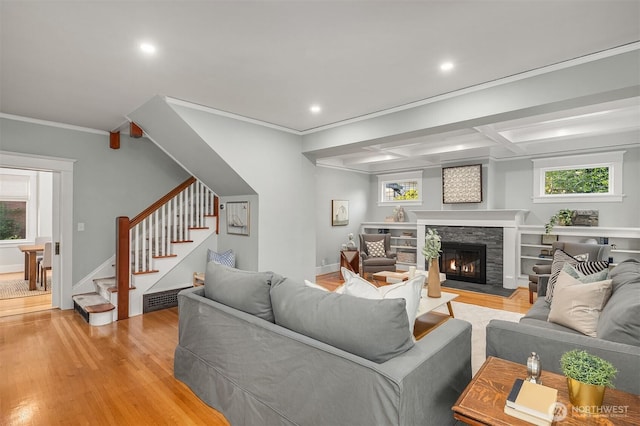 2836 32nd Ave S, Seattle, WA 98144 - living room with light wood-style flooring, stairway, ornamental molding, healthy amount of natural light, and a fireplace