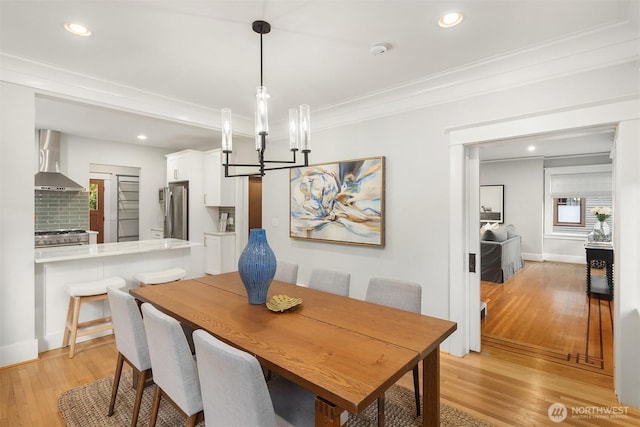 2836 32nd Ave S, Seattle, WA 98144 - dining room featuring light wood-type flooring, a chandelier, ornamental molding, and recessed lighting
