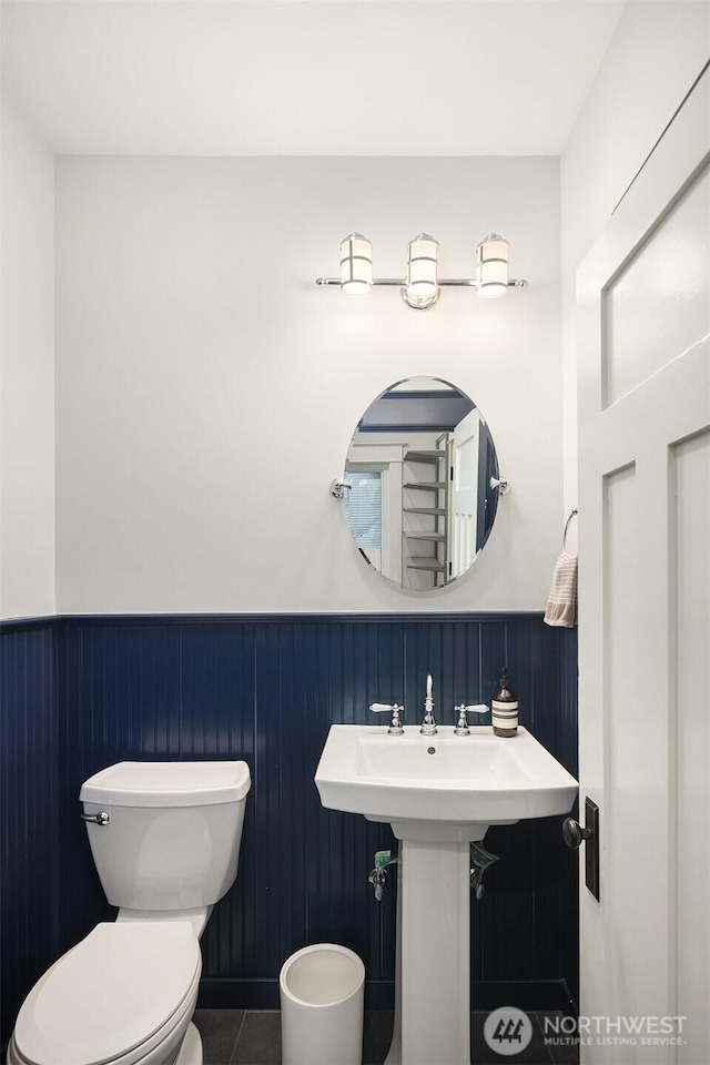 2836 32nd Ave S, Seattle, WA 98144 - bathroom featuring wainscoting and tile patterned flooring