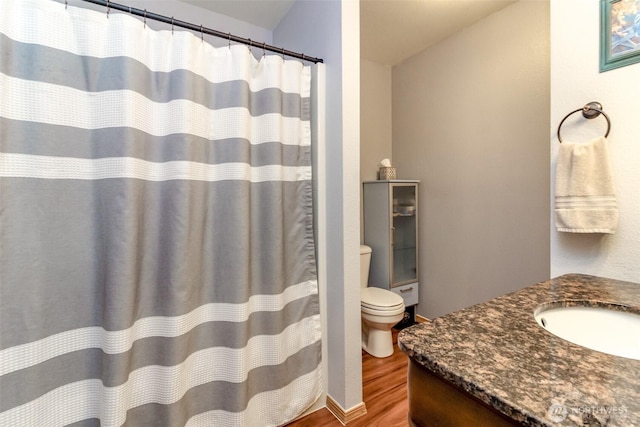 15205 197th St E, Orting, WA 98360 - full bathroom with wood finished floors, vanity, and a shower with shower curtain