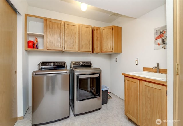 15205 197th St E, Orting, WA 98360 - laundry room featuring washing machine and dryer, cabinet space, and light flooring