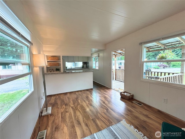 105 E Cox Ave Unit 13, Arlington, WA 98223 - unfurnished living room with dark wood-style flooring