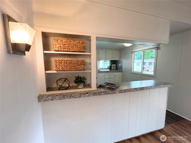 105 E Cox Ave Unit 13, Arlington, WA 98223 - kitchen featuring dark wood-type flooring, open shelves, stainless steel cooktop, and a peninsula