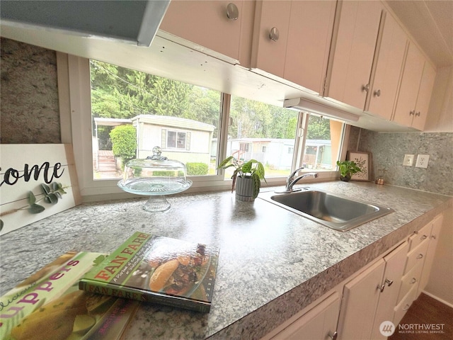 105 E Cox Ave Unit 13, Arlington, WA 98223 - kitchen featuring decorative backsplash and light countertops