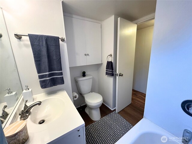 105 E Cox Ave Unit 13, Arlington, WA 98223 - full bath with wood finished floors, vanity, and a bath