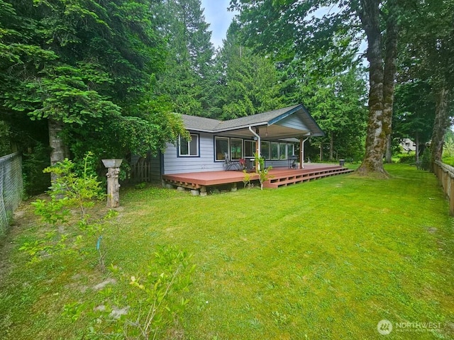 53802 State Route 2, Gold Bar, WA 98251 - rear view of house with a fenced backyard, a wooden deck, and roof with shingles