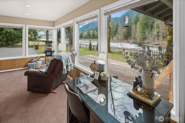 53802 State Route 2, Gold Bar, WA 98251 - sunroom / solarium featuring carpet flooring, a deck with water view, a view of trees, and recessed lighting