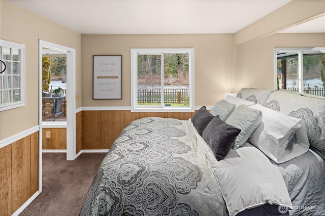 53802 State Route 2, Gold Bar, WA 98251 - carpeted bedroom with multiple windows, wood walls, and a wainscoted wall