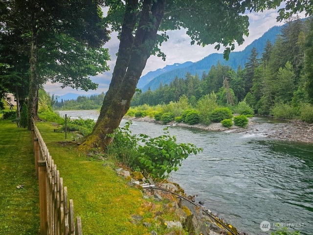 53802 State Route 2, Gold Bar, WA 98251 - water view with a heavily wooded area and a mountainous background