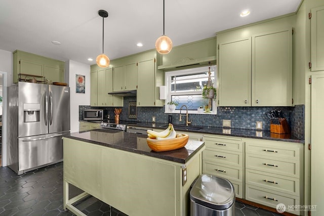 2914 N 15th St, Tacoma, WA 98406 - kitchen featuring appliances with stainless steel finishes, backsplash, green cabinetry, dark stone counters, and recessed lighting