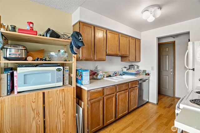 3590 Narrows View Ln NE Unit 203, Bremerton, WA 98310 - kitchen featuring white appliances, light countertops, light wood finished floors, and brown cabinetry