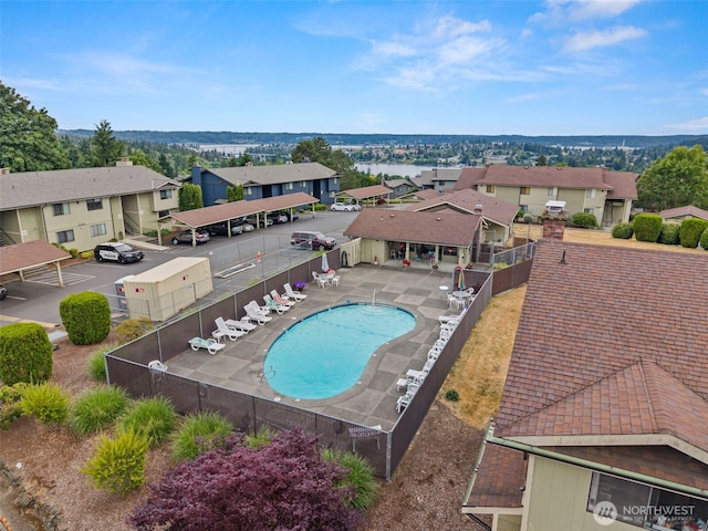 3590 Narrows View Ln NE Unit 203, Bremerton, WA 98310 - community pool featuring a residential view and a fenced backyard