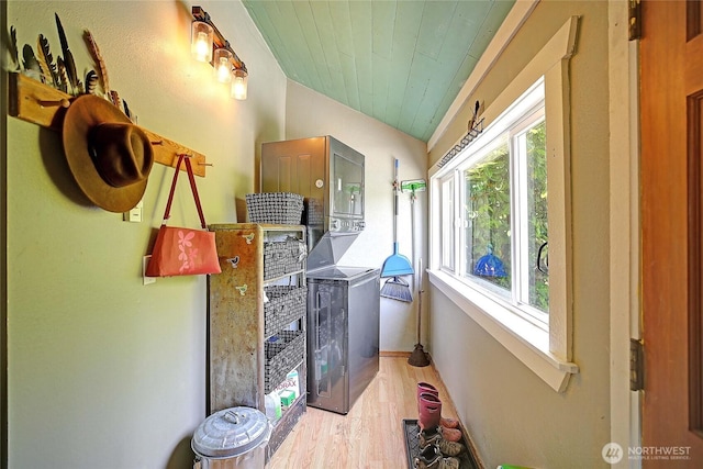 522 Chapman Rd, Camano Island, WA 98282 - laundry room featuring stacked washer / dryer, wood finished floors, and wood ceiling
