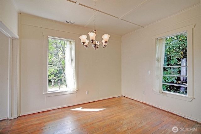 522 Chapman Rd, Camano Island, WA 98282 - unfurnished room featuring a chandelier and wood-type flooring