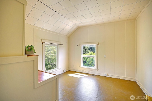 522 Chapman Rd, Camano Island, WA 98282 - empty room featuring lofted ceiling and a decorative wall