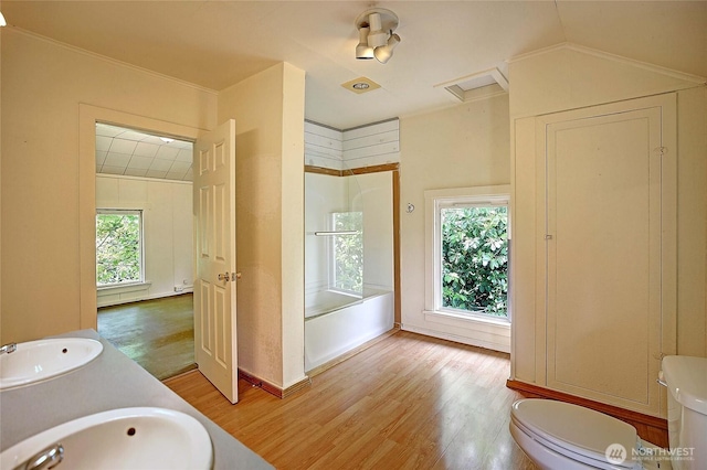 522 Chapman Rd, Camano Island, WA 98282 - bathroom featuring wood finished floors, tub / shower combination, and double vanity