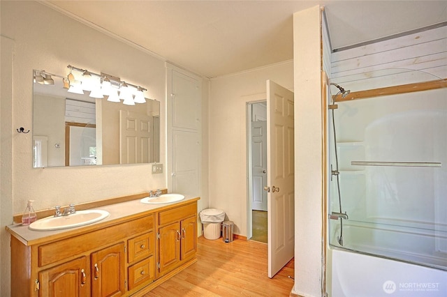 522 Chapman Rd, Camano Island, WA 98282 - full bathroom featuring wood finished floors, combined bath / shower with glass door, and double vanity