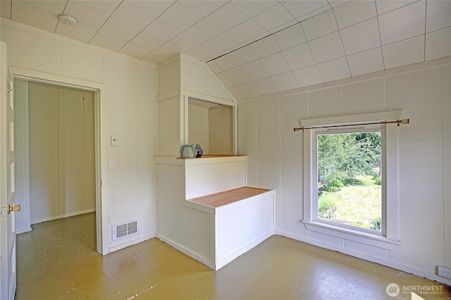 522 Chapman Rd, Camano Island, WA 98282 - unfurnished room with a decorative wall, a smoke detector, and lofted ceiling