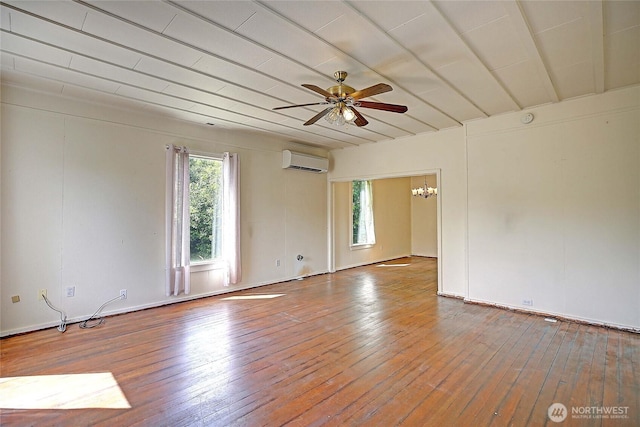 522 Chapman Rd, Camano Island, WA 98282 - empty room featuring a wall mounted AC, a chandelier, hardwood / wood-style flooring, and a ceiling fan