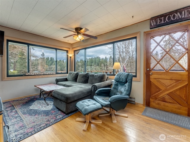 291 Hadaller Rd, Mossyrock, WA 98564 - living area featuring a baseboard heating unit, healthy amount of natural light, ceiling fan, and wood finished floors