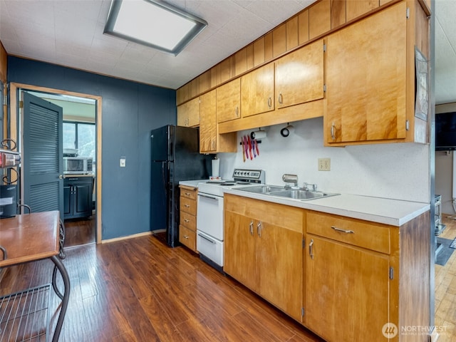 291 Hadaller Rd, Mossyrock, WA 98564 - kitchen with white range with electric stovetop, light countertops, dark wood-style flooring, freestanding refrigerator, and stainless steel microwave