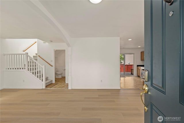 331 Index Ave SE, Renton, WA 98056 - foyer entrance with stairway, light wood-style floors, arched walkways, and recessed lighting